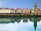 Harbour promenade in Lindau with reflection in the water. Tower Mangenturm, Bavaria, Germany, Europe.