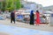 A harbour scene in Turkey with people walking by on the pavement