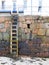 Harbour wall and wooden ladder