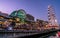 Harbourside shopping centre view at dusk in Darling Harbour with Ferris wheel and people in Sydney NSW Australia