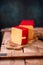 Hard cheese parmesan on wooden board on sunlight table traditional table texture side