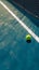 Hard court scene tennis ball placed on white line