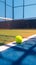 Hard court scene tennis ball placed on white line