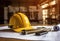 a hard hat sits on top of red blueprints on a table