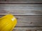 Hard Hats Yellow Cap Mine Safety Appliances on  wood table