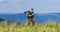 Hard way. army forces. sniper reach target mountain. military style. male in camouflage. muscular man hold weapon