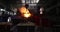 Hard work in the foundry. Pouring molten steel. Liquid steel pouring.