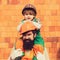 Hard work. Tired builders. Ote and son with similarities. Similarity of children and parent. Bearded father and son in a