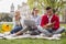 Hard-working students feeling amazing drinking coffee in the park