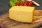 Hard yellow tasty cheese brick