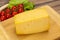 Hard yellow tasty cheese brick