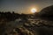 Hardened lava magma sunset Sunset over the sea and the mountains. reflected in the puddles lakes mountains and sky