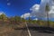 Hardened lava of the volcano on the background of blue sky.