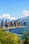 Harder Kulm, Interlaken, Switzerland - July 16 2019: People taking picture on viewing platform above Swiss Interlaken. Alps in