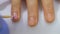 Hardware manicure, close-up, nail care beautiful woman in beauty salon. Manicure with varnish. The nail treatment