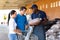 Hardware store salesman assisting customers