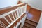 Hardwood handrail banister and white steel balustrade on brown wooden stair interior decorated modern style