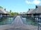 Hardwood path to over water Bungalows Bora Bora resort