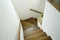 Hardwood stair steps and white wall