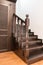 A hardwood staircase and stairwell storage