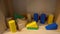 Hardwood wooden building block set for toddlers preschool age. Colored small wood blocks. Basic educational play toy