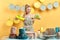 Hardworking blonde woman mixing different dishwashing detergents