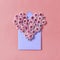 Hardy chrysanthemums heart with envelope for post card on a pastel background.