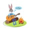 Hare the bard at the picnic bonfire playing the guitar and singing songs.