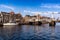 HARLEM, NETHERLANDS - APRIL 14, 2018: Spaarne river with boats, famous tourist landmark Gravestenenbrug bridge and houses in