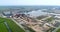 Harlingen Industrial Port with Factory and Sand Piles, Following Truck – Friesland, The Netherlands, 4K Drone Footage