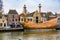 Harlingen, Netherlands - January 10, 2020. Old historic vessel in Zuiderhaven canal in winter