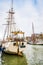 Harlingen, Nethrelands - January 10, 2020. Boats in water canal in downtown in winter