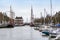 Harlingen, Nethrelands - January 10, 2020. Boats in water canal in downtown in winter