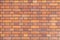 Harmonic background of brick wall in red plaster stones in america