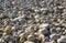 Harmonic background at pebbel beach with stones formed by the ocean