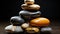 Harmonious Heights: Stacked Polished Rocks in Black, Gold, and Silver