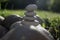 Harmony and balance, cairns, simple poise stones in the garden, rock zen sculpture, white pebbles, single tower