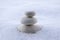 Harmony and balance, cairns, simple poise stones on white background, rock zen sculpture, white pebbles, single tower, simplicity