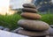 Harmony and balance, simple pebble tower in the grass, simplicity, five stones