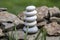 Harmony and balance, simple pebbles tower in another pebbles, simplicity, five stones