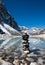 Harmony: Stone stack and Sacred Lake near Gokyo