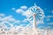 Harnessing the Wind: A Paper-Cut Wind Turbine against a Blue Sky, Symbolizing Clean and Renewable Energy