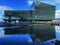 Harpa Operahouse in Reykjavik mirroring in water.