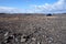 Harsh landscape in Iceland with blue car