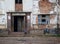 A Harsh Life - Boy peeping into building. Harare slum