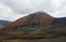 Harsh mountain landscape with road serpentine at the top of the pass