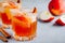 Harvest apple punch with cinnamon and ice for Halloween or Thanksgiving in glass