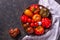 The harvest of assorted tomatoes. Colorful organic tomatoes on a large dish