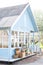 Harvest concept. Autumn harvest of plenty. Cozy blue house with a beautiful garden on a sunny day. Rustic style. autumn concept. H