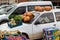 Harvest Festival, bright large pumpkins, greens and other vegetables ready for sale at the street fair are located on the hood and